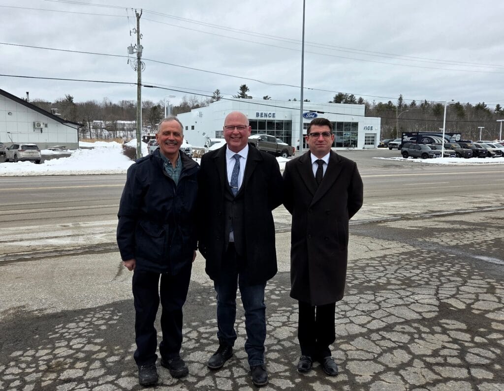 Picture of Reeve Tony Fritsch, Hastings/L&A MPP Ric Bresee and L&A County Warden Nathan Townend standing in front of Highway 7 in Kaladar.